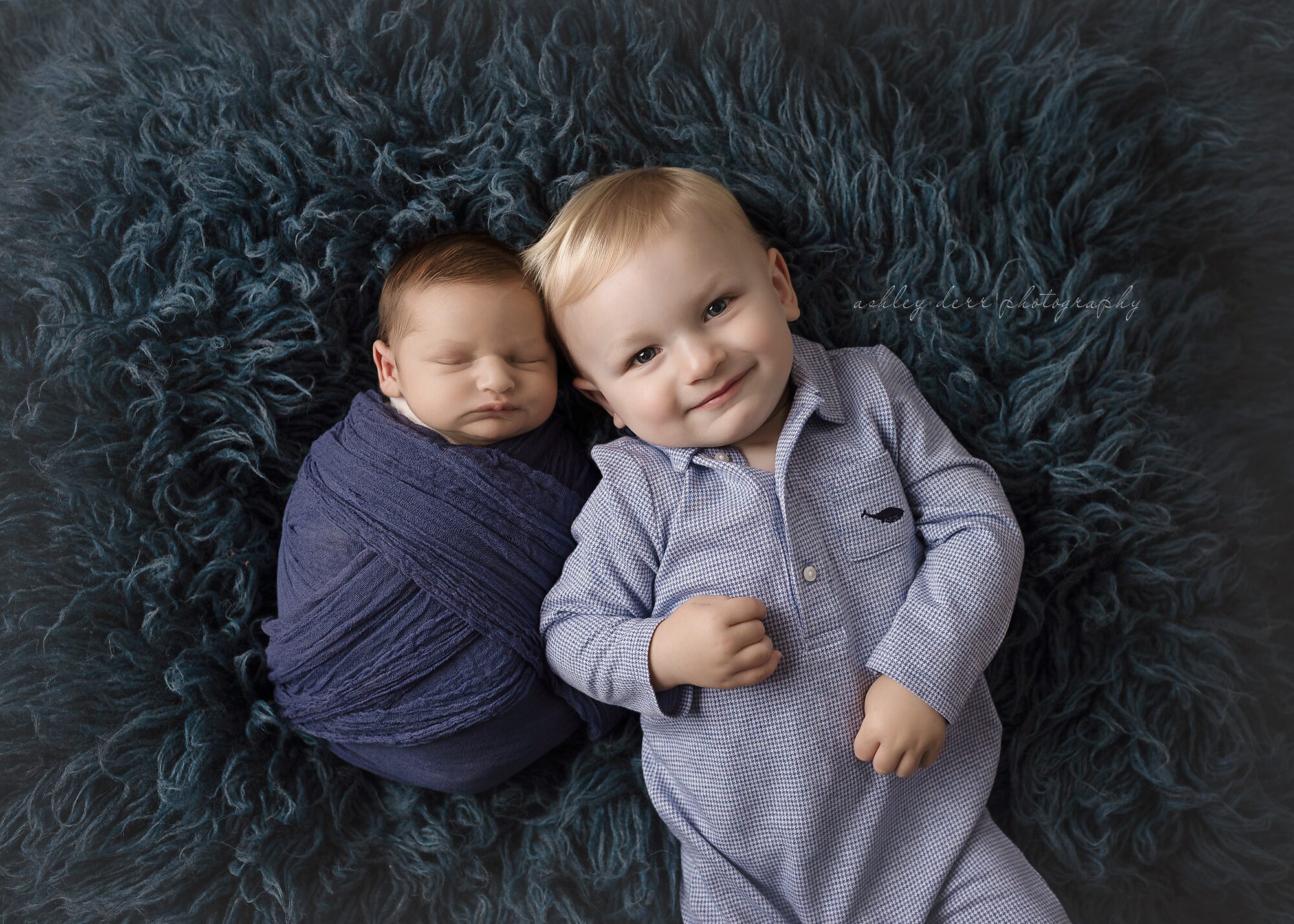 newborn boy and sibling posing pittsburgh pa